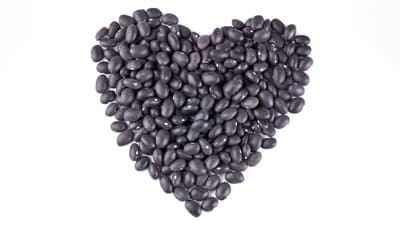 NutriSavvy_Black_Beans_Heart_DP_18419583_400x225 A heart made of black beans on a white background